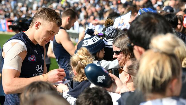 Patrick Cripps signs autographs during an open training session this week. Picture: Quinn Rooney/Getty Images