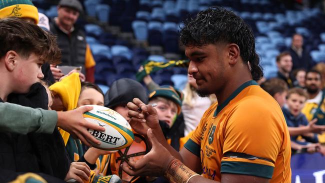 Isaac Kailea signs autographs after his debut in Sydney. Picture: Cameron Spencer/Getty Images