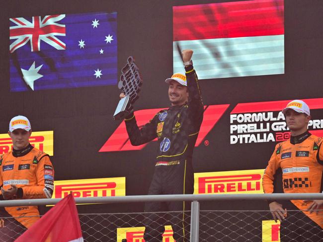 McLaren duo Oscar Piastri (L) and Lando Norris sandwiched Charles Leclerc on the podium. Picture: Andrej Isakovic/AFP