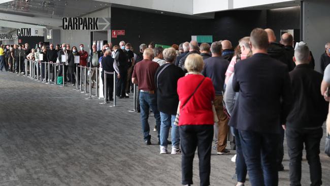 The line-up outside the centre. Monday, May 3, 2021. Picture: David Crosling