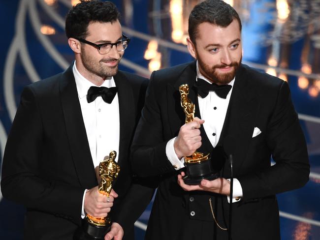 Songwriter Jimmy Napes and Sam Smith accept the Best Original Song award.