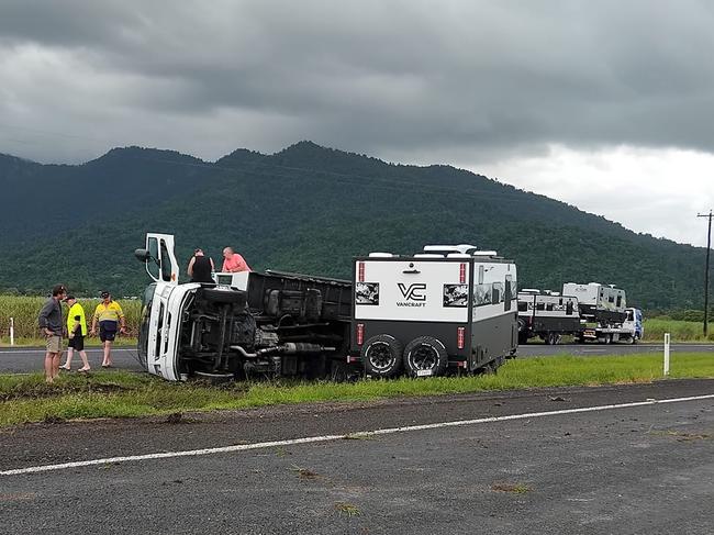 A truck carrying and towing caravans rolled on the Bruce Highway near Babinda on Saturday morning. Picture: Supplied