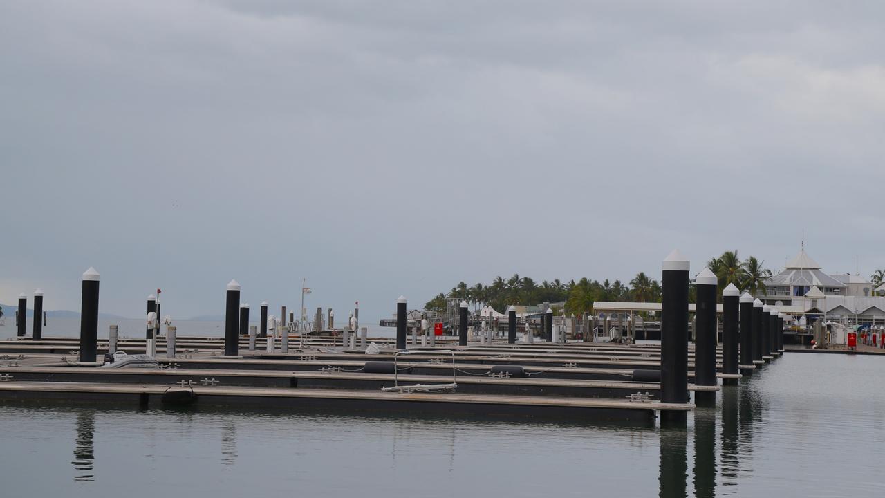 An eerie calm hangs over the deserted Crystalbrook Superyacht Marina in Port Douglas. The marina is now displaying the red port alert beacon ahead of Cyclone Jasper's arrival. Picture: Peter Carruthers