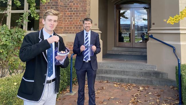 Thomas Foster co-captain of school with Richard Ford headmaster. Creation of PPE (personal protective equipment) by Launceston Grammar students and staff. Picture: SUPPLIED