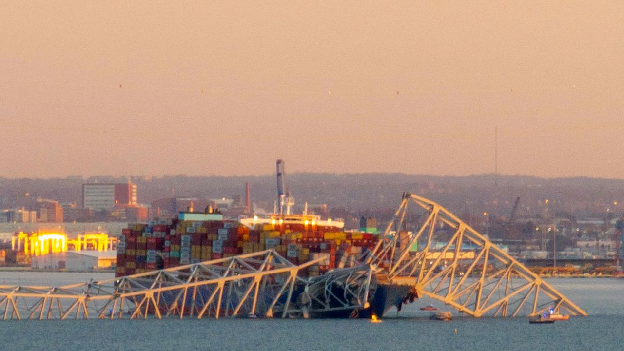 The collapsed bridge sent multiple vehicles and up to 20 people plunging into the harbour below. Picture: AFP