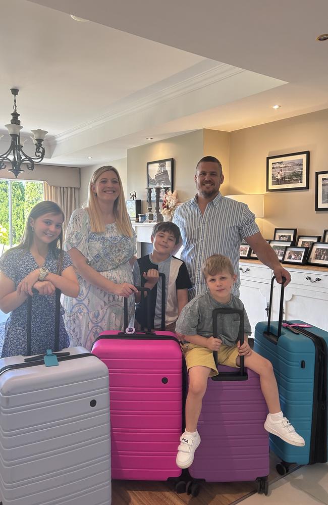 Julie and Josh Brown, with their three children aged 12, nine and five.