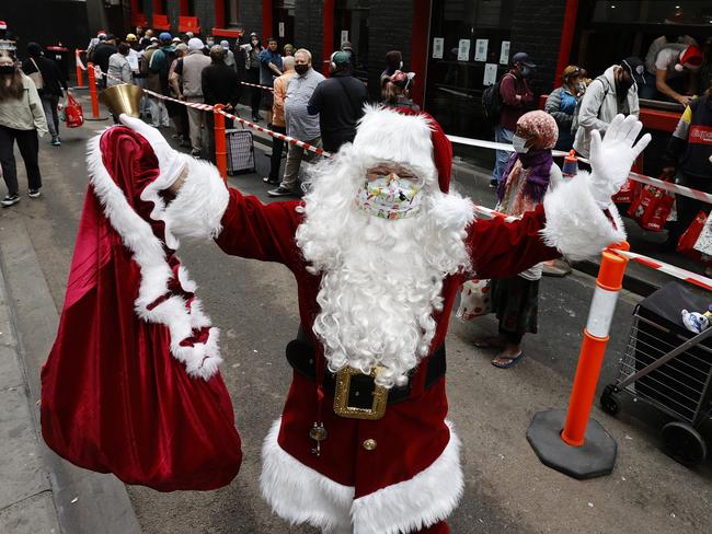 Santa giving gifts on Christmas Day. Picture: Alex Coppel.