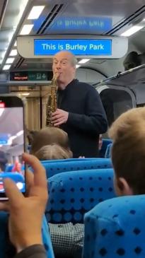 Retired music teacher surprises train passengers