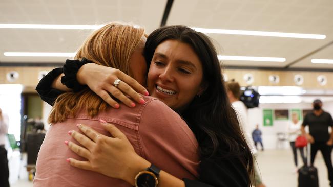 Tara Mrhar is reunited with her mum Vesna Mrhar after she arrived on the flight from Melbourne at Hobart airport after the borders reopened to Victoria today. Picture: Zak Simmonds