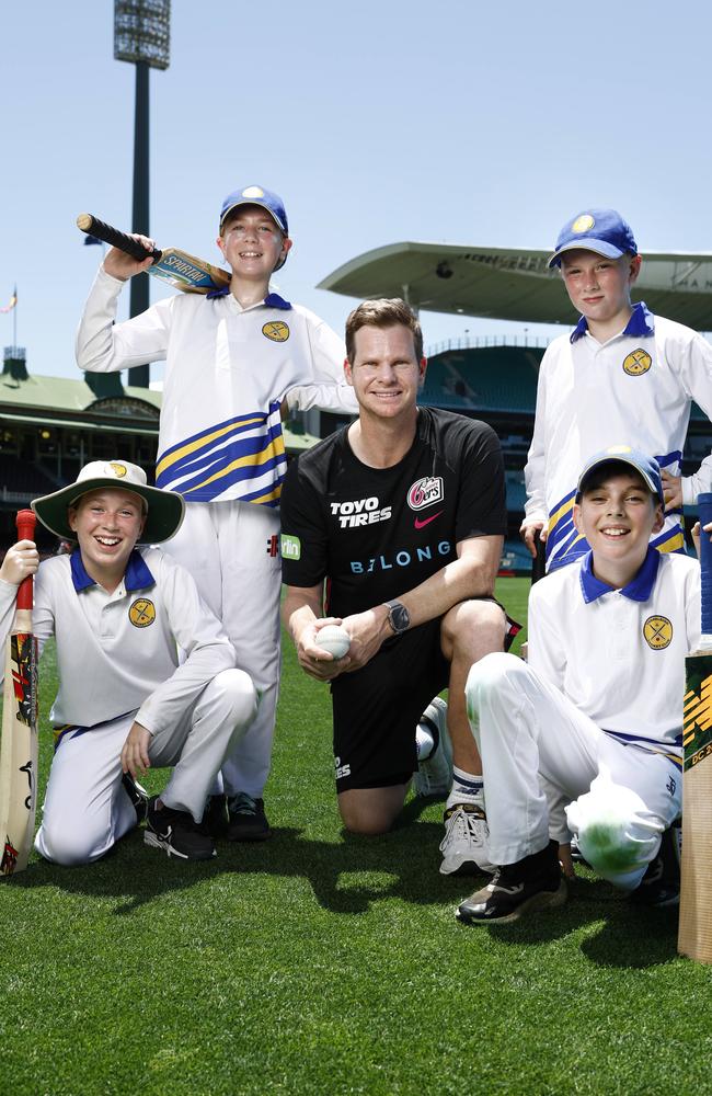 Australian test cricketer and Sydney Sixers team member Steve Smith with Thornleigh Cricket Club Juniors players Lily Barden, Chloe Scott, Ethan Oliveri and Jarvis Whitney. Picture: Richard Dobson