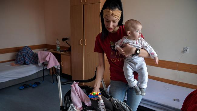 Olesya Sinchenko, 20, from Voznesensk, a Ukrainian city in Mykolaiv Oblast, with her baby in the dormitory of a high school in Przemysl, eastern Poland, where vulnerable refugees from Ukraine are being sheltered. Picture: AFP