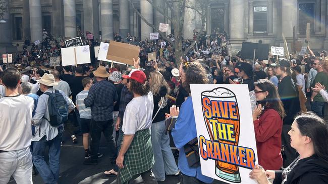 The march to save the Crown &amp; Anchor Hotel reaches Parliament House. Picture: Natalie Vikhrov