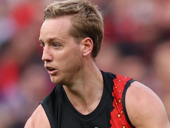 MELBOURNE, AUSTRALIA - APRIL 25: Darcy Parish of the Bombers runs with the ball during the round seven AFL match between Essendon Bombers and Collingwood Magpies at Melbourne Cricket Ground, on April 25, 2024, in Melbourne, Australia. (Photo by Robert Cianflone/Getty Images)