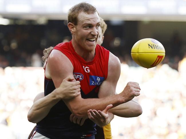 MELBOURNE, AUSTRALIA - MARCH 23: Harrison Petty of the Demons handballs during the round two AFL match between Hawthorn Hawks and Melbourne Demons at Melbourne Cricket Ground, on March 23, 2024, in Melbourne, Australia. (Photo by Darrian Traynor/Getty Images)