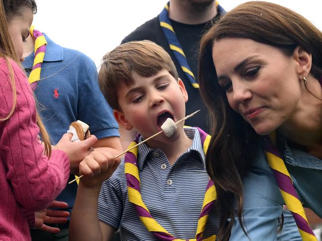 LONDON, ENGLAND - MAY 08: Prince Louis of Wales and Catherine, Princess of Wales toast marshmallows as they take part in the Big Help Out, during a visit to the 3rd Upton Scouts Hut in Slough on May 8, 2023 in London, England. The Big Help Out is a day when people are encouraged to volunteer in their communities. It is part of the celebrations of the Coronation of Charles III and his wife, Camilla, as King and Queen of the United Kingdom of Great Britain and Northern Ireland, and the other Commonwealth realms that took place at Westminster Abbey on Saturday, May 6, 2023. (Photo by Daniel Leal - WPA Pool/Getty Images)