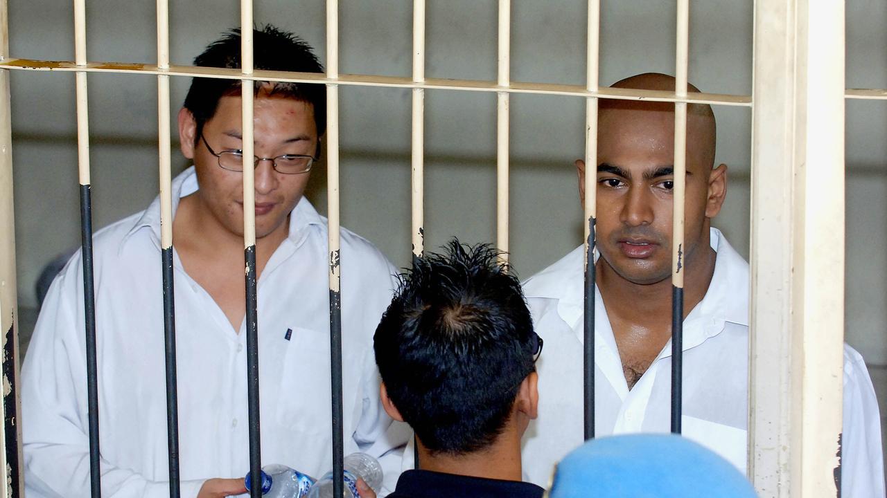 Executed Australian prisoners Myuran Sukumaran, right and Andrew Chan, left, stand in front of their cell during an Indonesian Independence Day celebration at Kerobokan prison in Bali, Indonesia. Picture: AP Photo/Firdia Lisnawati