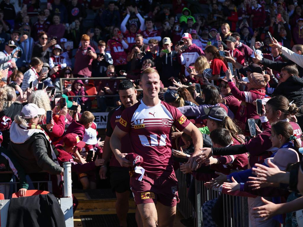 Daly Cherry-Evans parting the Maroon sea. Picture: Adam Head