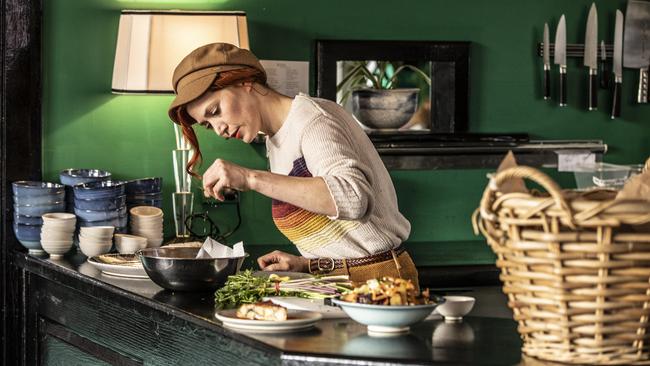 <i>MasterChef </i>star Sarah Clare puts the finishing touches on one of her dishes at her new restaurant, Ilha, in Cygnet. Picture: EDDIE SAFARIK