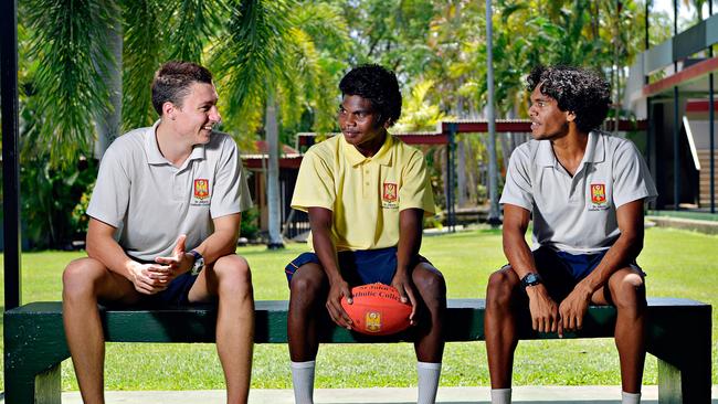 Coen Hutt, Maurice Rioli, and William Holtfitz talk footy at St Johns' Catholic College.