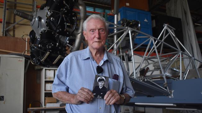 Peter Groom holds a photo of his younger self of when he served in the Royal Navy Fleet Air Arm during World War Two. Photo: Stuart Fast