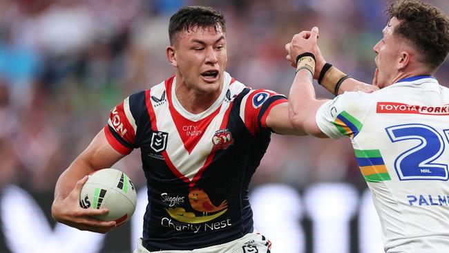 SYDNEY, AUSTRALIA - SEPTEMBER 01: Joseph Manu of the Roosters fends off a tackle from Adam Cook of the Raiders during the round 26 NRL match between Sydney Roosters and Canberra Raiders at Allianz Stadium, on September 01, 2024, in Sydney, Australia. (Photo by Cameron Spencer/Getty Images)