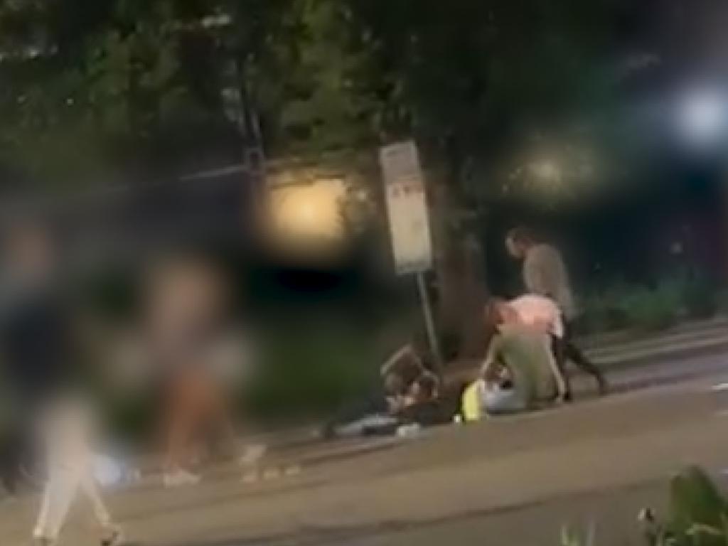 An officer lies on the ground. Picture: Victoria Police