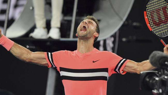 Grigor Dimitrov celebrates after defeating Mackenzie McDonald in their second round match at the Australian Open. Picture: AP