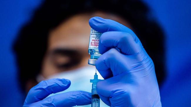 A medical worker loads a syringe with the Moderna COVID-19 vaccine. Picture: AFP