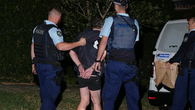 A man being arrested this month after a 50-year-old woman was stabbed in the chest during a domestic violence situation in East Ryde. Picture: Bill Hearne