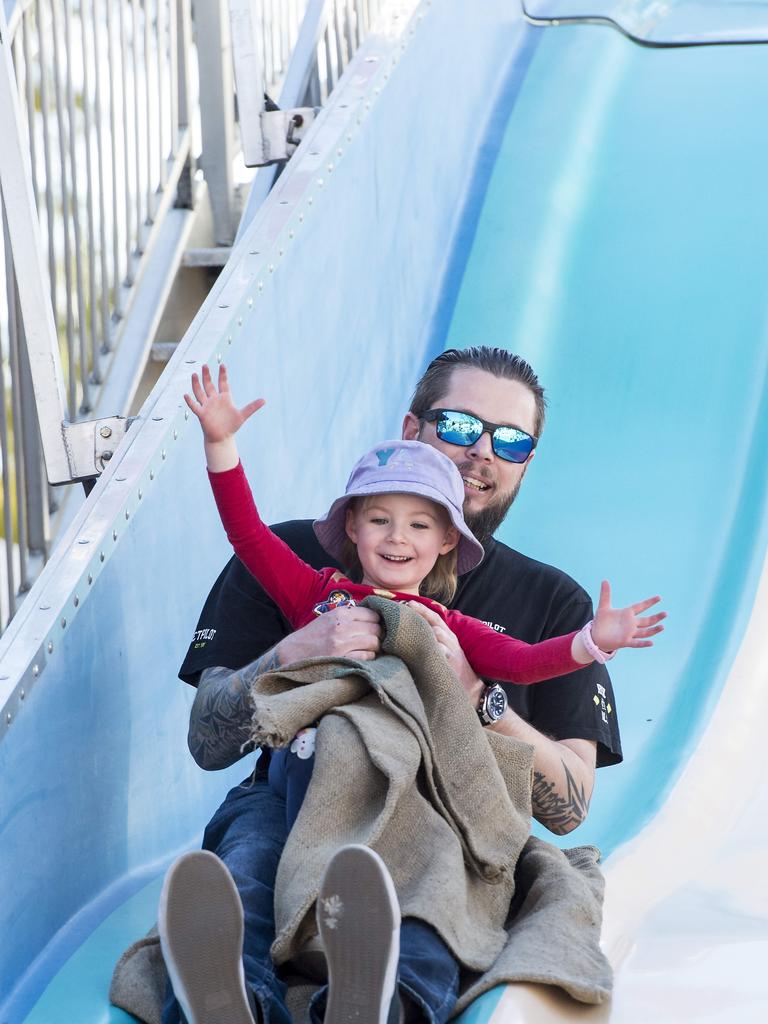 Conan Abbott and daughter Paige,4, enjoying the giant slide.