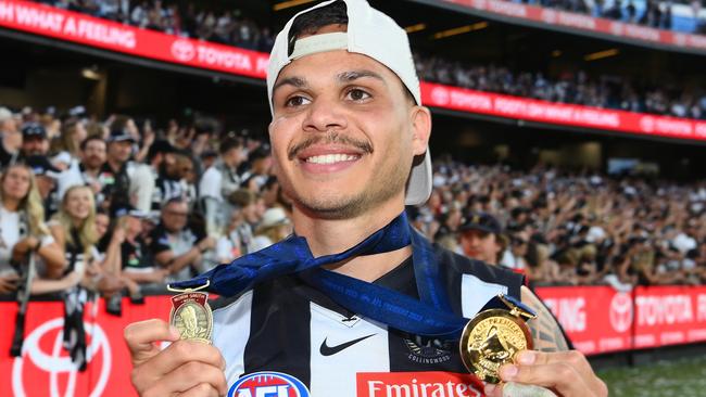 MELBOURNE, AUSTRALIA - SEPTEMBER 30: Bobby Hill of the Magpies celebrates winning the Norm Smith edal and premiership during the 2023 AFL Grand Final match between Collingwood Magpies and Brisbane Lions at Melbourne Cricket Ground, on September 30, 2023, in Melbourne, Australia. (Photo by Quinn Rooney/Getty Images)