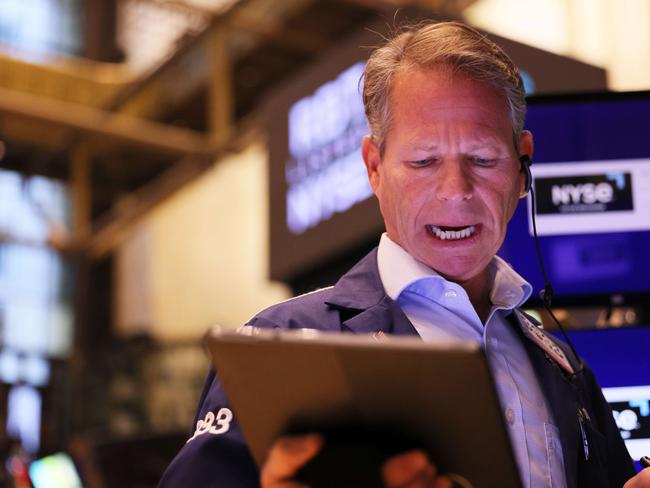 NEW YORK, NEW YORK - OCTOBER 18: Traders work on the floor of the New York Stock exchange during morning trading on October 18, 2022 in New York City. The stock market opened on an upswing with the Dow Jones gaining over 600 points, the S&P 500 jumping 2.20% and the Nasdaq Composite with a gain of 2.6% adding to the gains that began on Monday.   Michael M. Santiago/Getty Images/AFP