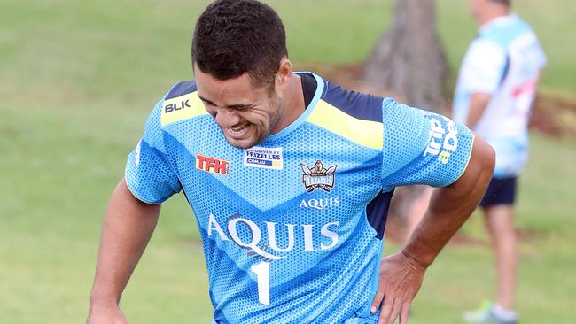 Jarryd Hayne feels the pain during Titans pre-season training. Picture: Richard Gosling