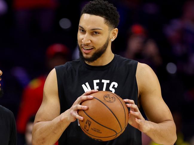 PHILADELPHIA, PENNSYLVANIA - MARCH 10:  Patty Mills #8 and Ben Simmons #10 of the Brooklyn Nets take the court for warm ups before the game against the Philadelphia 76ers at Wells Fargo Center on March 10, 2022 in Philadelphia, Pennsylvania. NOTE TO USER: User expressly acknowledges and agrees that, by downloading and or using this photograph, User is consenting to the terms and conditions of the Getty Images License Agreement. (Photo by Elsa/Getty Images)