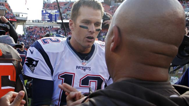 New England Patriots quarterback Tom Brady (12) meets with Cleveland Browns head coach Hue Jackson after the game.