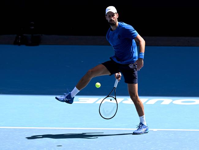 Serbia's Novak Djokovic hits a return during a training session ahead of the Australian Open tennis tournament in Melbourne on January 9, 2025. (Photo by William WEST / AFP) / -- IMAGE RESTRICTED TO EDITORIAL USE - STRICTLY NO COMMERCIAL USE --