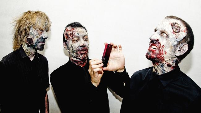 Nice young men. Regurgitator with new masks for a new tour.