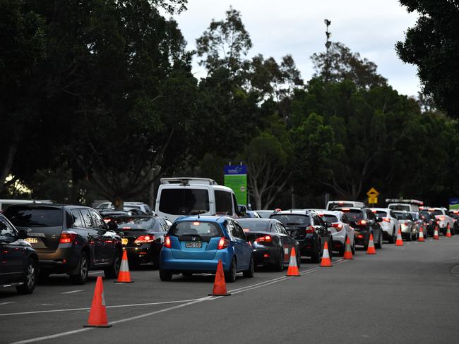 People queue in cars at the Fairfield Showground Covid testing site in Sydney. Picture: NCA NewsWire