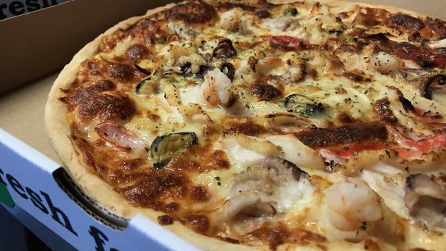 Amore pizza with smoked salmon, prawns, red onion, olives and spinach. Picture: Jenifer Jagielski