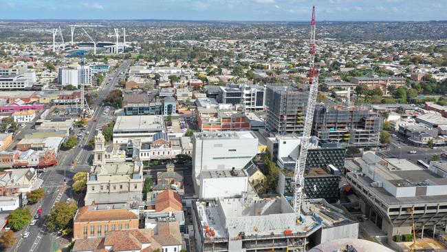 Cranes stand above developments at Geelong Arts Centre, Geelong Quarter, Quest Geelong Central Hotel and GMHBA Stadium projects under construction in April. Picture: Alan Barber