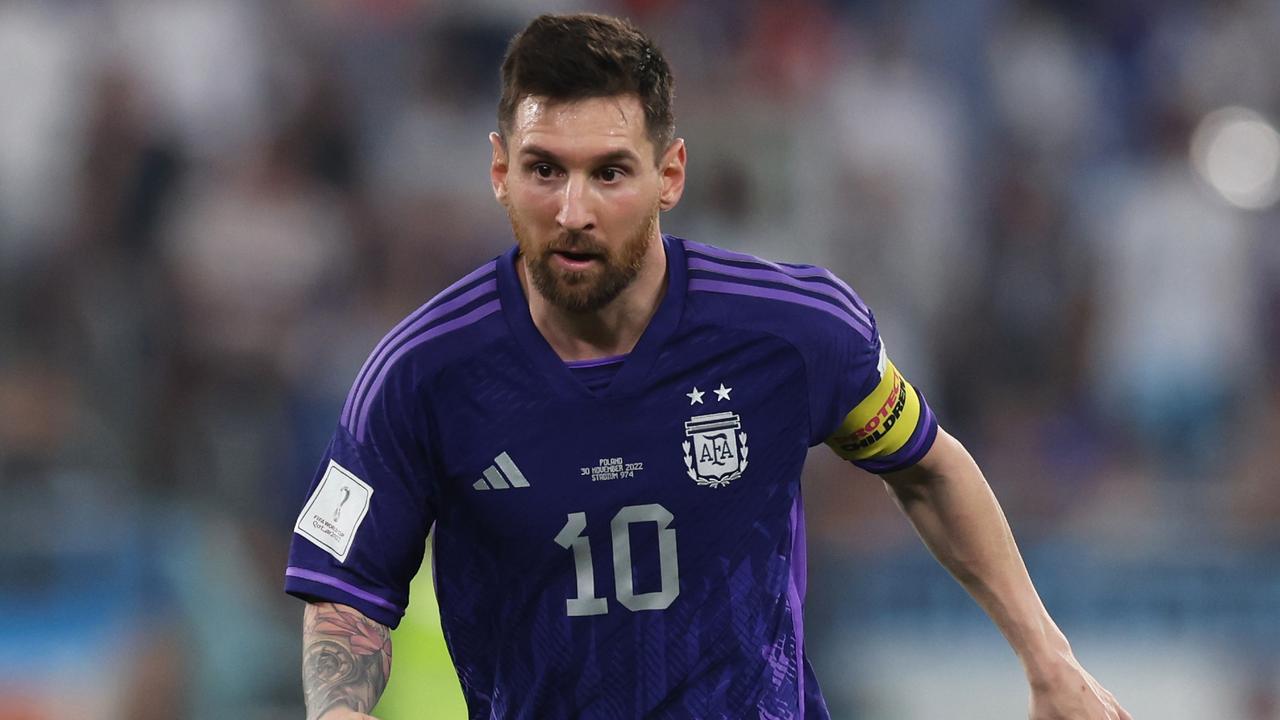 DOHA, QATAR - NOVEMBER 30: Lionel Messi of Argentina runs with the ball during the FIFA World Cup Qatar 2022 Group C match between Poland and Argentina at Stadium 974 on November 30, 2022 in Doha, Qatar. (Photo by Clive Brunskill/Getty Images)