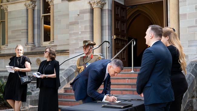 Premier Peter Malinauskas signing condolences on arrival. Picture: Tim Joy