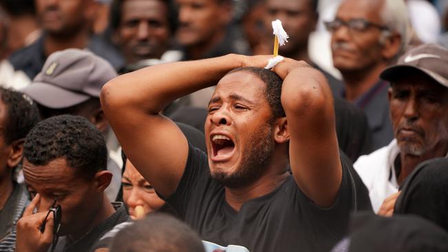 A mourner screams for a loved one who perished in the Ethiopian Airways ET302 crash during a memorial service at Selassie Church on March 17. Picture: Getty