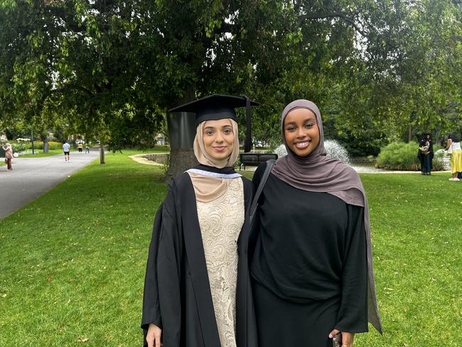 Hala Koubar, with a friend, graduates with a Bachelor of Design at the University of Melbourne's Faculty of Architecture, Building and Planning graduation ceremony at the Royal Exhibition Building on December 6, 2024. Picture: Harvey Constable