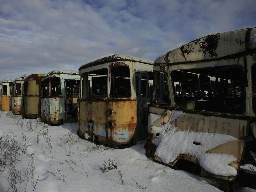 Highly radiated buses used for transport during the 1986 catastrophe lay in a field near the village of Rosoha on January 31, 2006 in Chernobyl, Ukraine. Picture: Daniel Berehulak/Getty Images