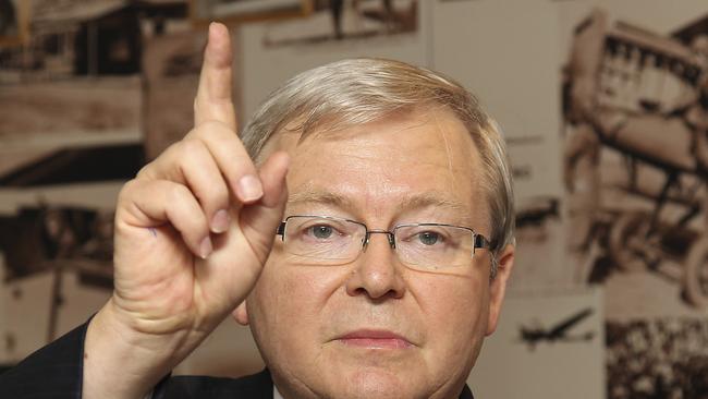 FILE - In this Friday, Feb. 24, 2012 file photo, former Australian Prime Minister Kevin Rudd speaks during a press conference after his arrival at Brisbane airport, Australia. Speculation is intensifying that Prime Minister Julia Gillard will soon face a leadership challenge in the face of opinion polls that suggest her government is headed for a crushing defeat at elections this year. Center-left Labor Party government lawmakers on Wednesday, March 29, 2013 publically stood by their beleaguered leader. But The Australian Financial Review newspaper reported three unnamed senior Gillard backers saying support among government ranks for her predecessor Rudd was growing. (AP Photo/Tertius Pickard, File)