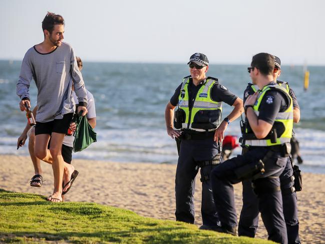 Police at St Kilda foreshore on New Year’s Eve. Picture: Martin Keep