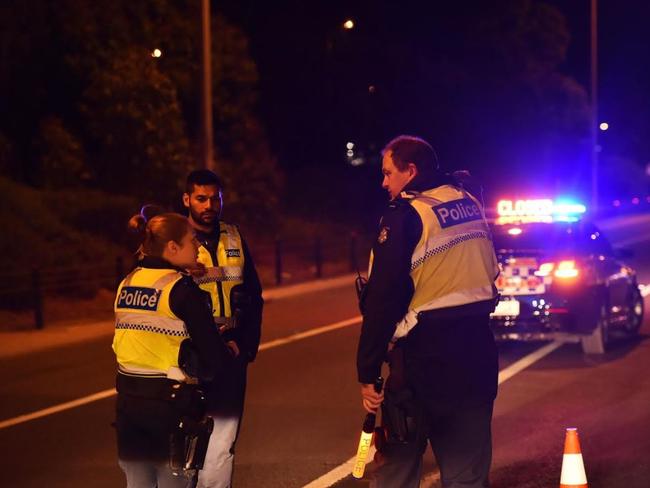 Police block entrances to Melbourne Airport late last night. Picture: Rob Leeson