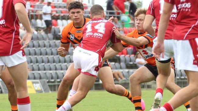 Big Kobi Floro saddles up to make a tackle earlier in the Connell Cup. The big Wavell SHS student played Meninga Cup for the improved Tigers at the weekend.