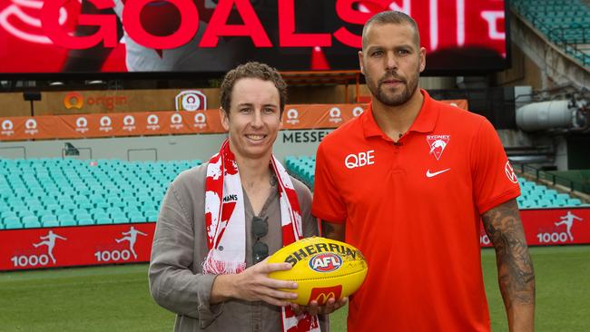 Fan Alex Wheeler hand the match ball back to Lance Franklin. Picture: NCA Newswire / Gaye Gerard